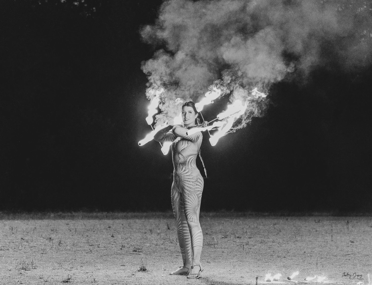 Black and white sequence of smoke or explosion effects against dark background.
