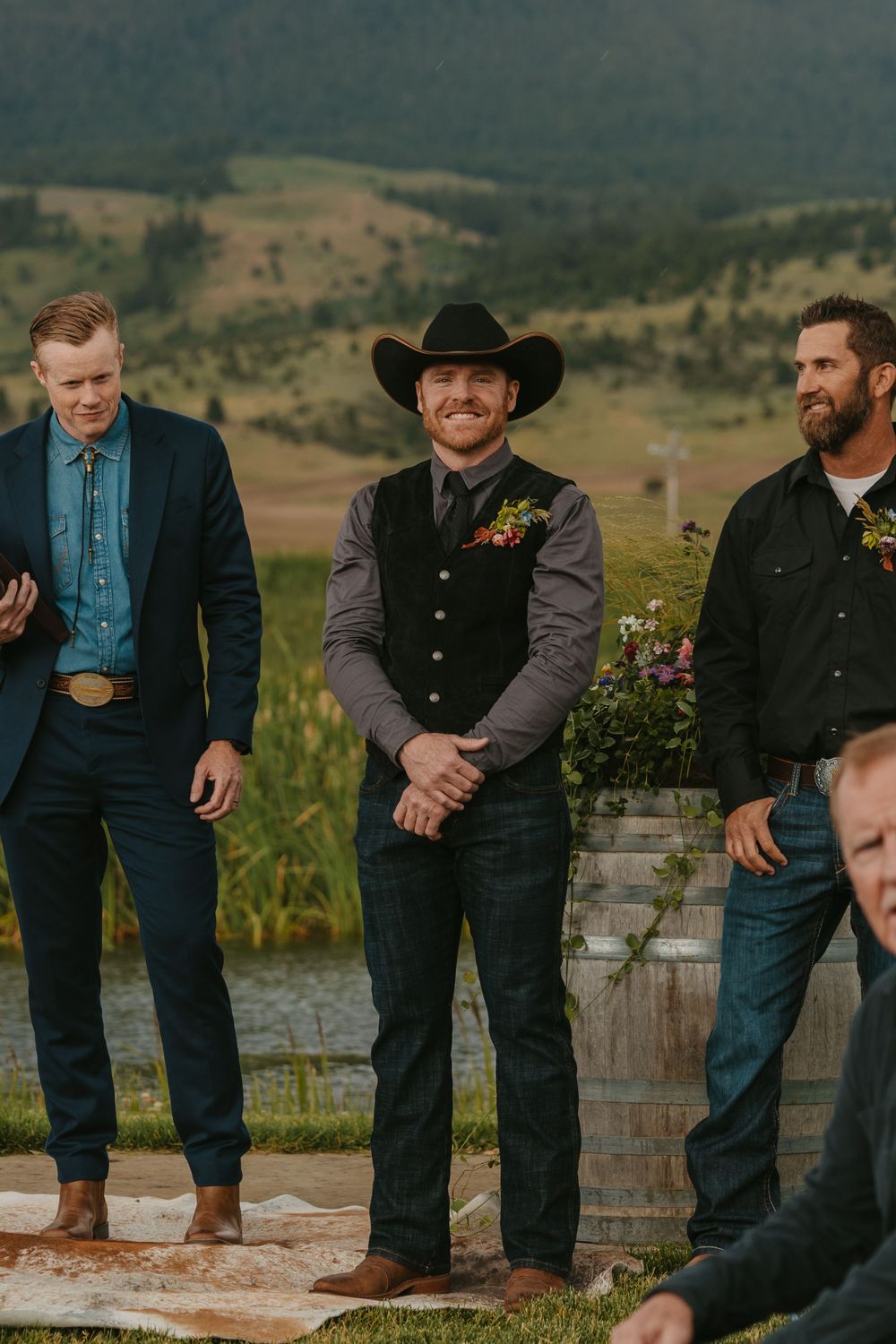 Groom waits for his bride at alter at Copper Rose Ranch at their Western Wedding on a rainy day in Livingston Montana by local photographer