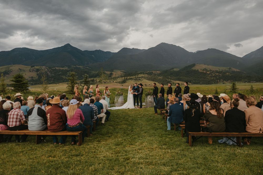 Ceremony at Copper Rose Ranch on her rainy wedding day in Pray, Montana Paradise Valley captured by Emigrant Wedding photographer