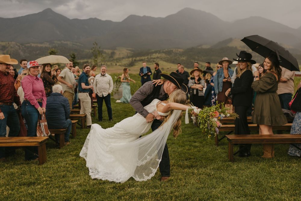 Dip Kiss at Copper Rose Ranch on her rainy wedding day in Pray, Montana Paradise Valley captured by Livingston, Montana Wedding photographer