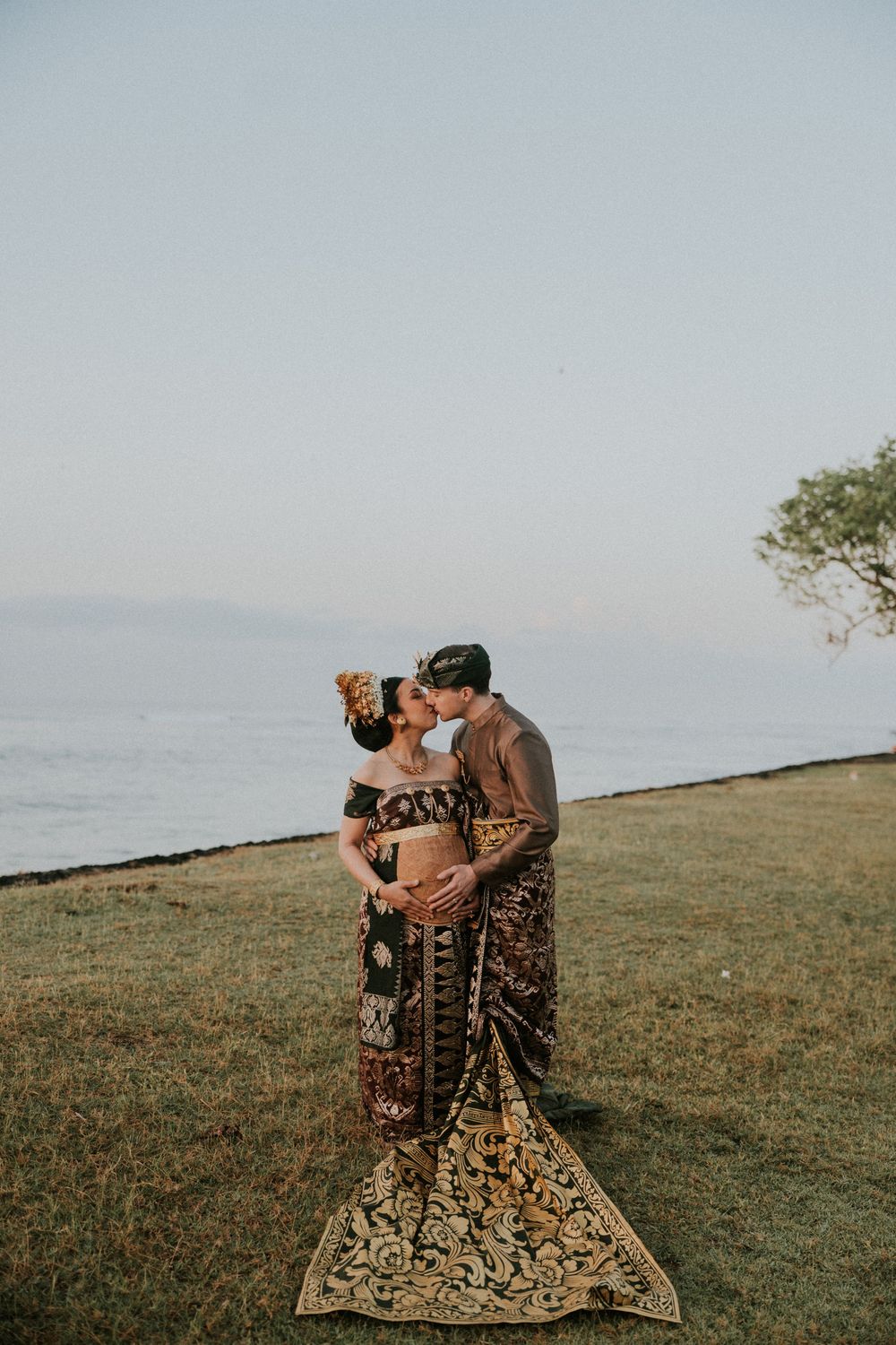 Maternity photography session with Balinese attire on Saba Beach Bali.