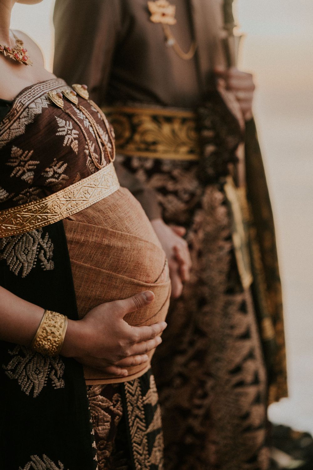 Maternity photography session with Balinese attire on Saba Beach Bali.