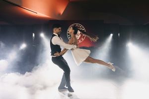 Atmospheric wedding dance photos with fog and dramatic lighting effects.
