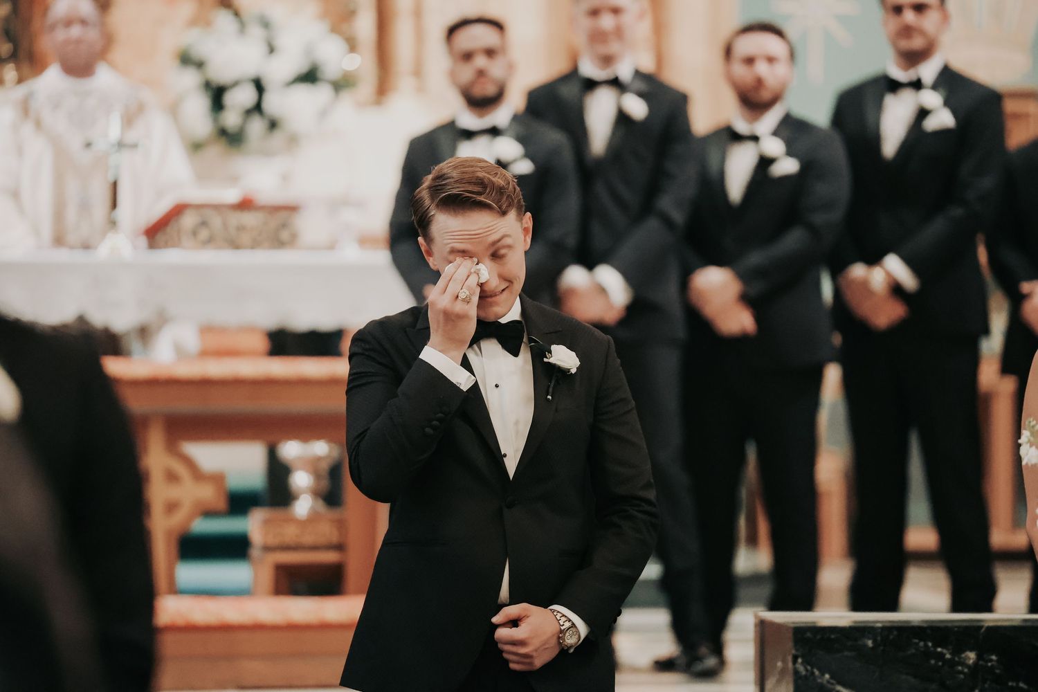 Nicole and Payton meeting at the altar during their Dallas wedding