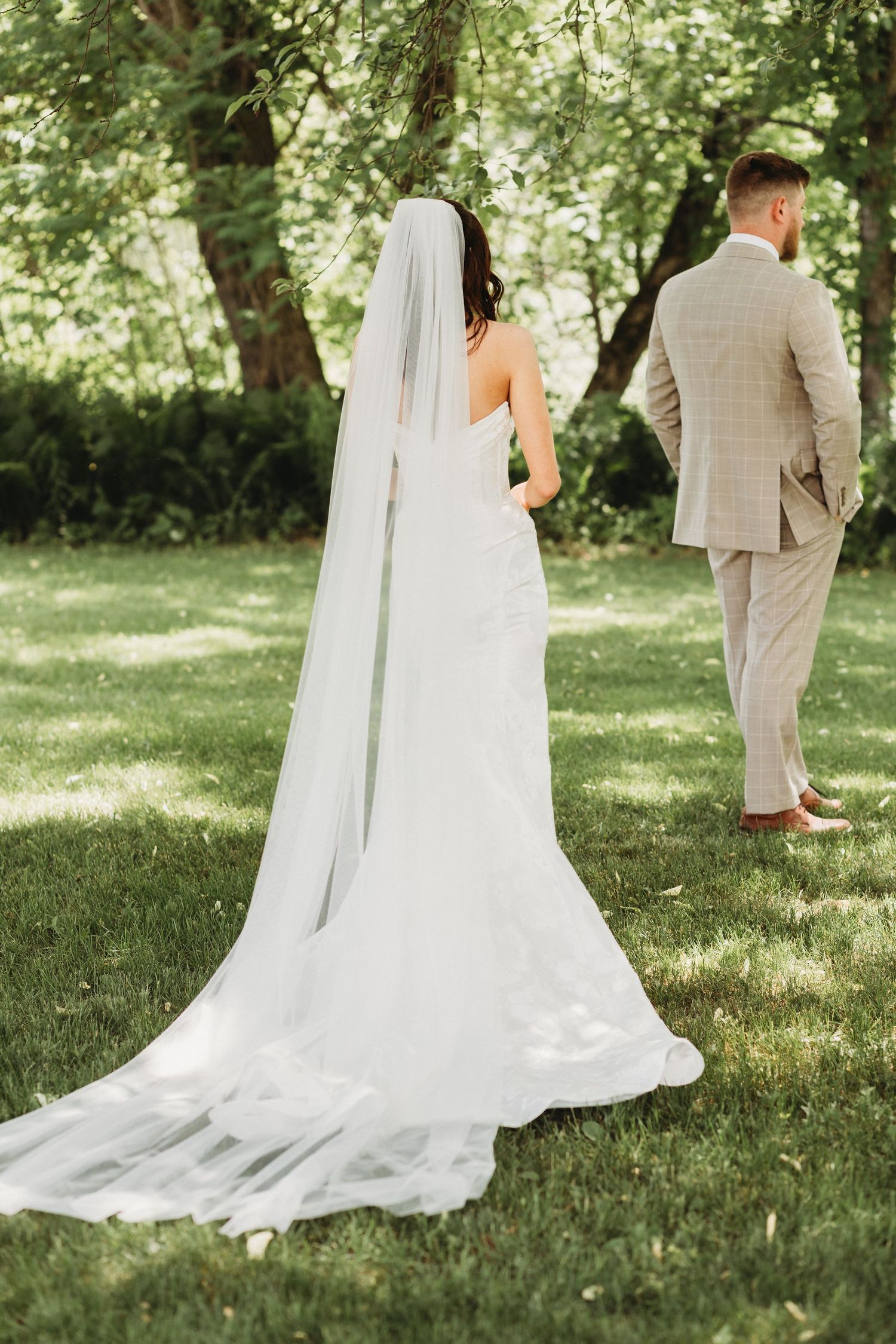 wedding couple doing there first look at the barn at loon cove in skowhegan maine captured by their maine wedding photographer