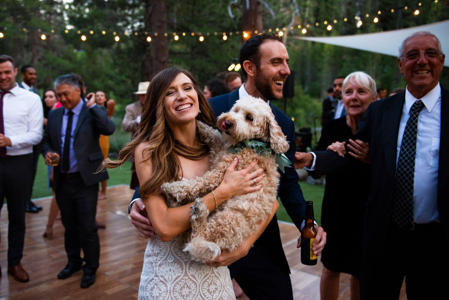 Couple dances with their dog at their wedding at Dancing Pines in Sierraville.