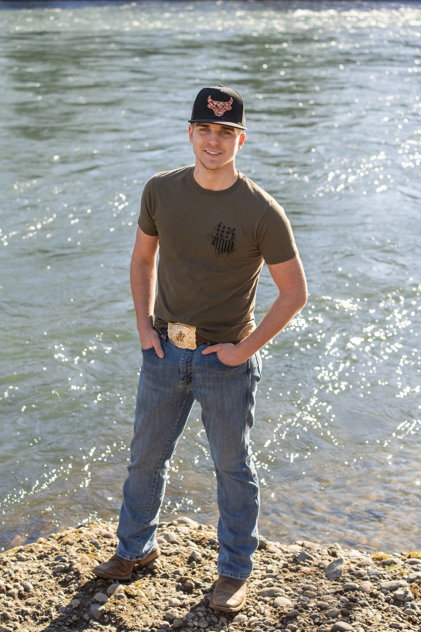 senior portrait by the Rogue River of a young man