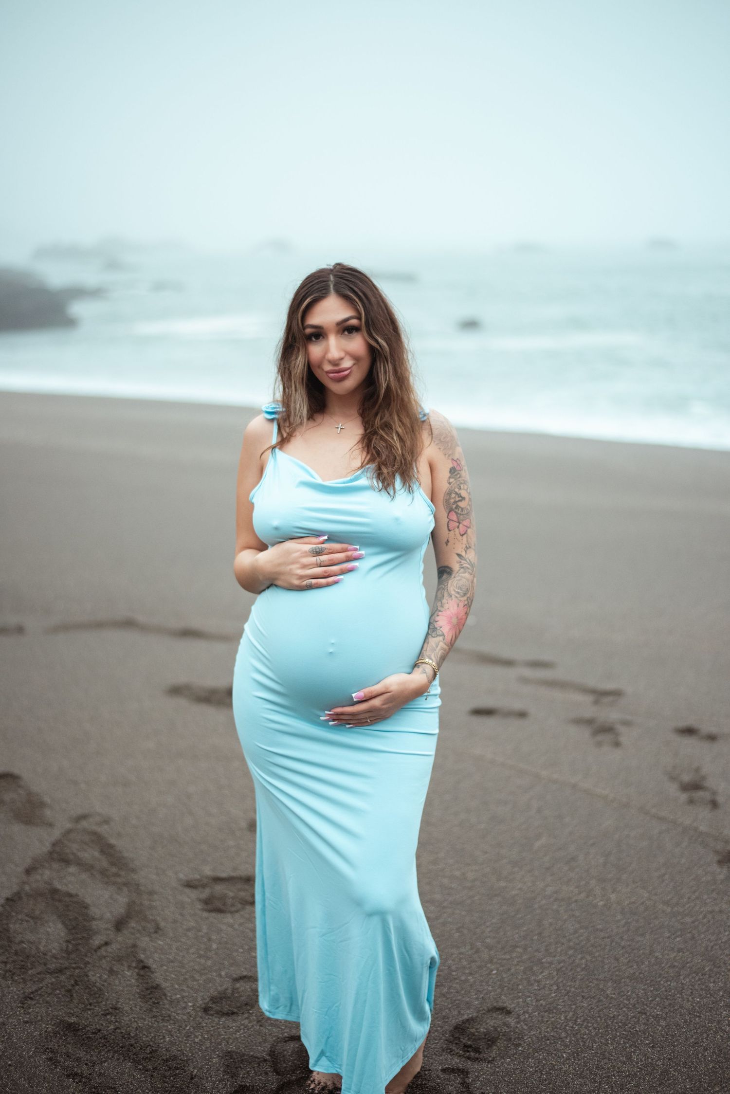 Sonoma Coast maternity photographer capturing cinematic beach maternity photos with natural light, ocean views, + beautiful, intimate moment