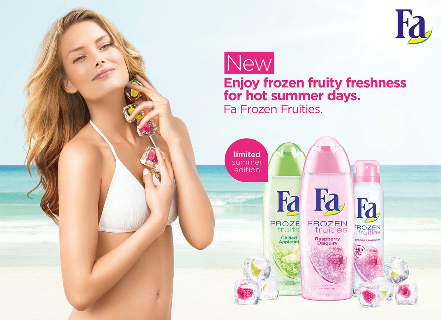 Woman in bikini holding Fa Frozen Fruities deodorant spray products on sunny beach.