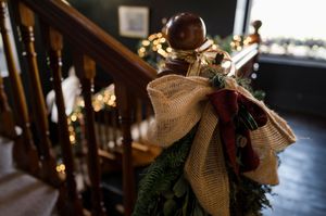Christmas staircase decorated with garland, burlap bow, and twinkling lights at Boyne Hill House Estate, Co.Meath