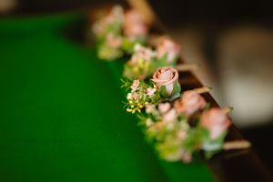Delicate pink roses and small flowers arranged along a wooden edge of the snooker table at Boyne Hill House Estate, Co. Meath.