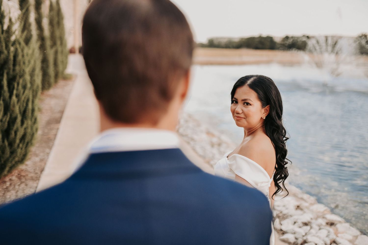 Engaged couple walking hand in hand through Chapel at Palacios during their North Texas session