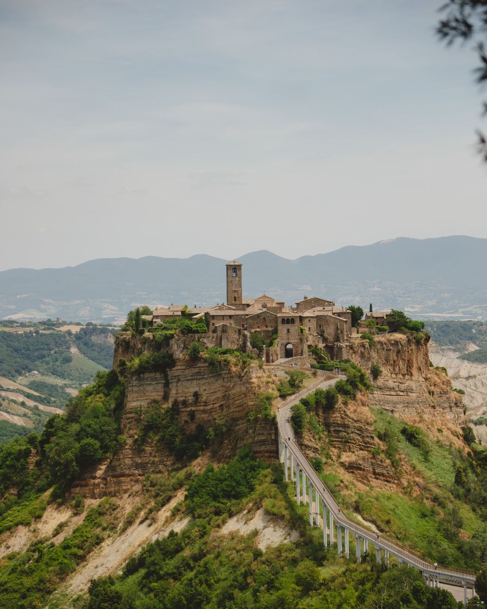 Hilltop village of Civita di Bagnoregio with rolling hills, Italy travel photography