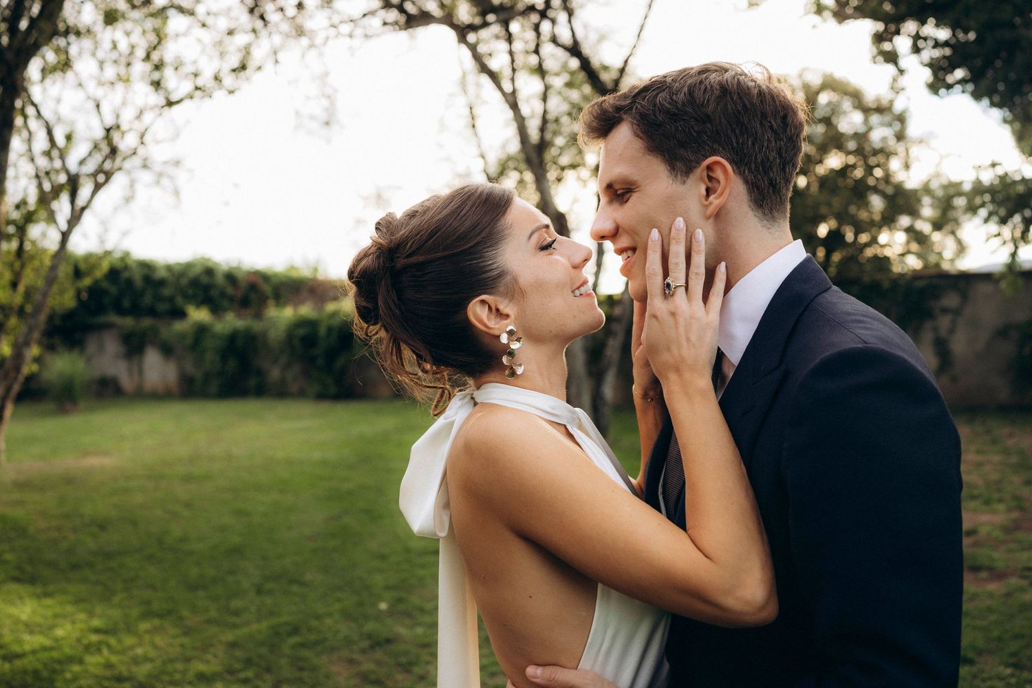 A romantic dance silhouette under stone archways with warm lighting.