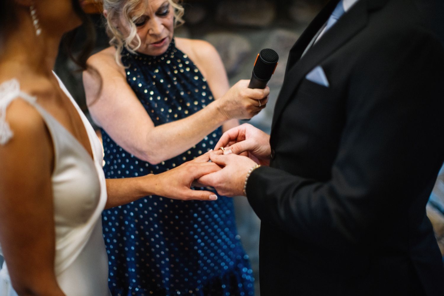 Ring exchange at a Post Hotel wedding ceremony in Lake Louise