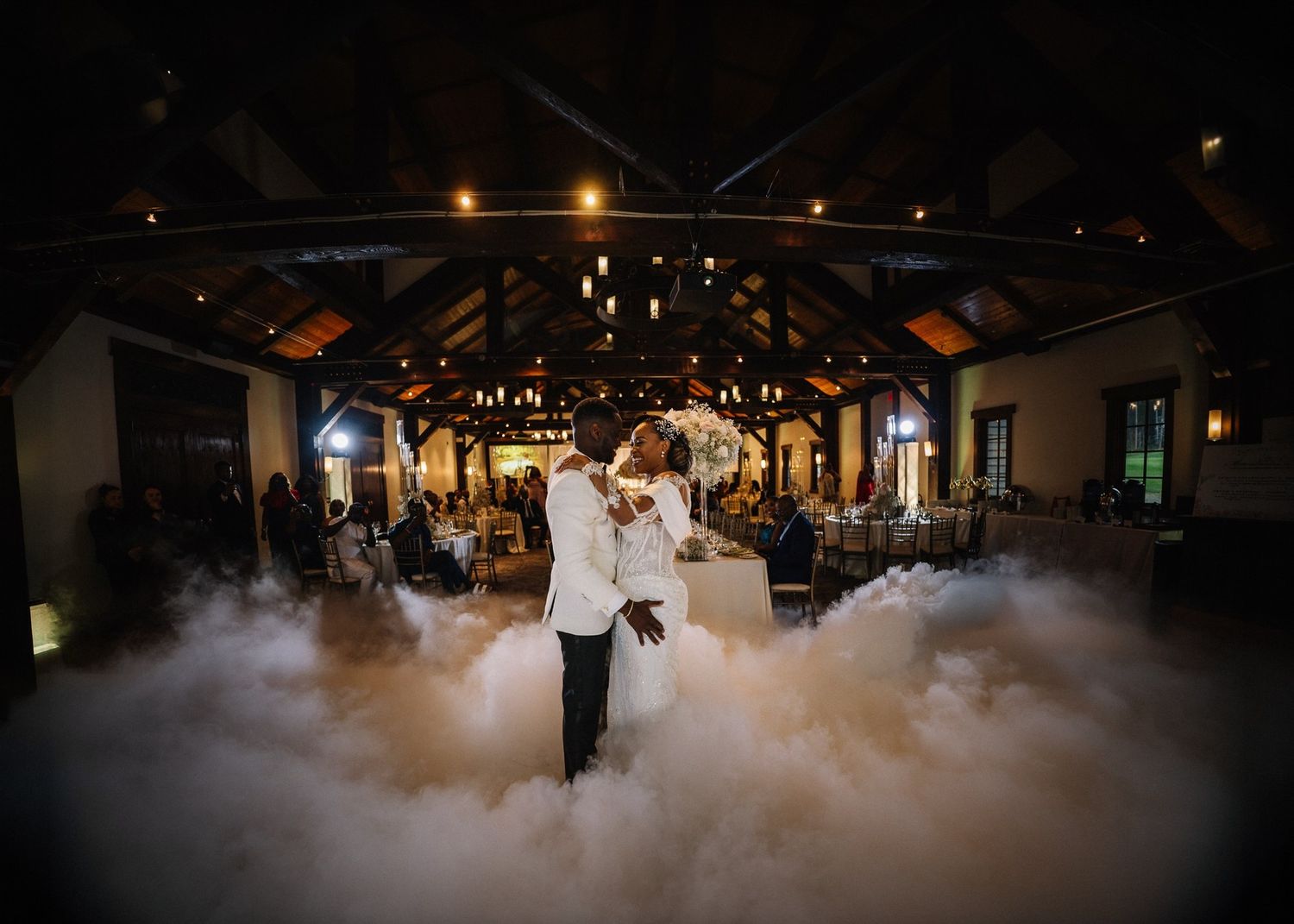 Couple dancing in low-lying fog in the Pavilion at Silvertip Resort