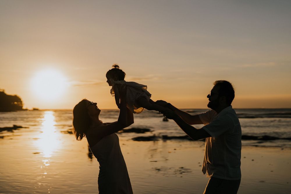 Natural sunset family portrait at Muaya Beach Jimbaran