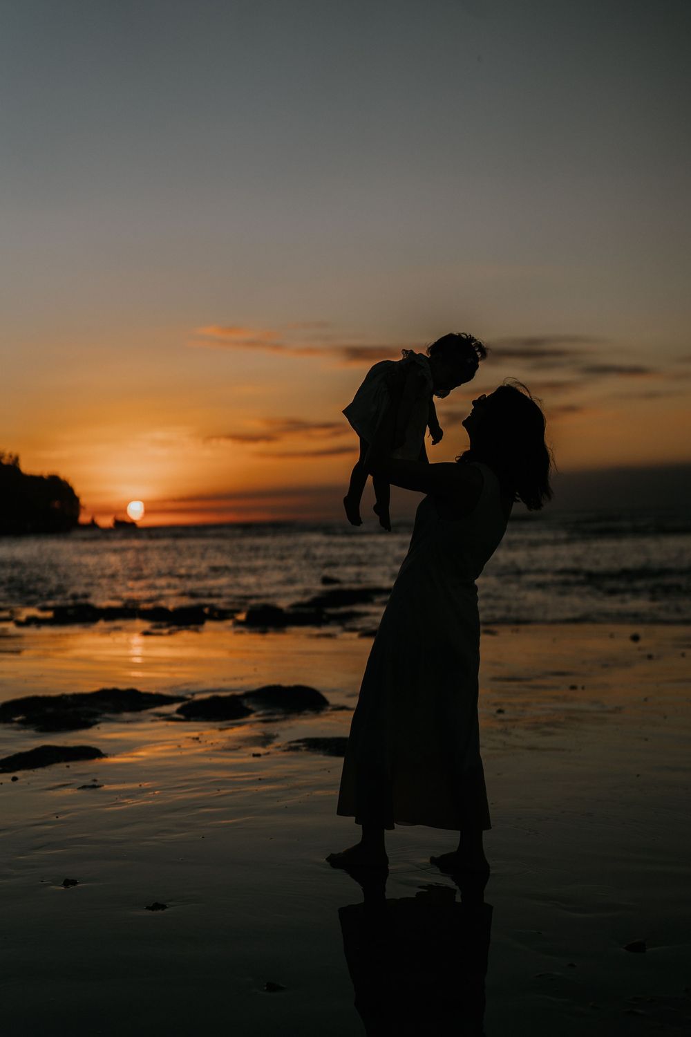 Natural sunset family portrait at Muaya Beach Jimbaran