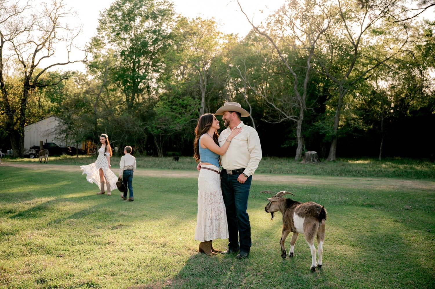 Parents sharing a candid moment together during their western-inspired family session at Good Vibes Farm.