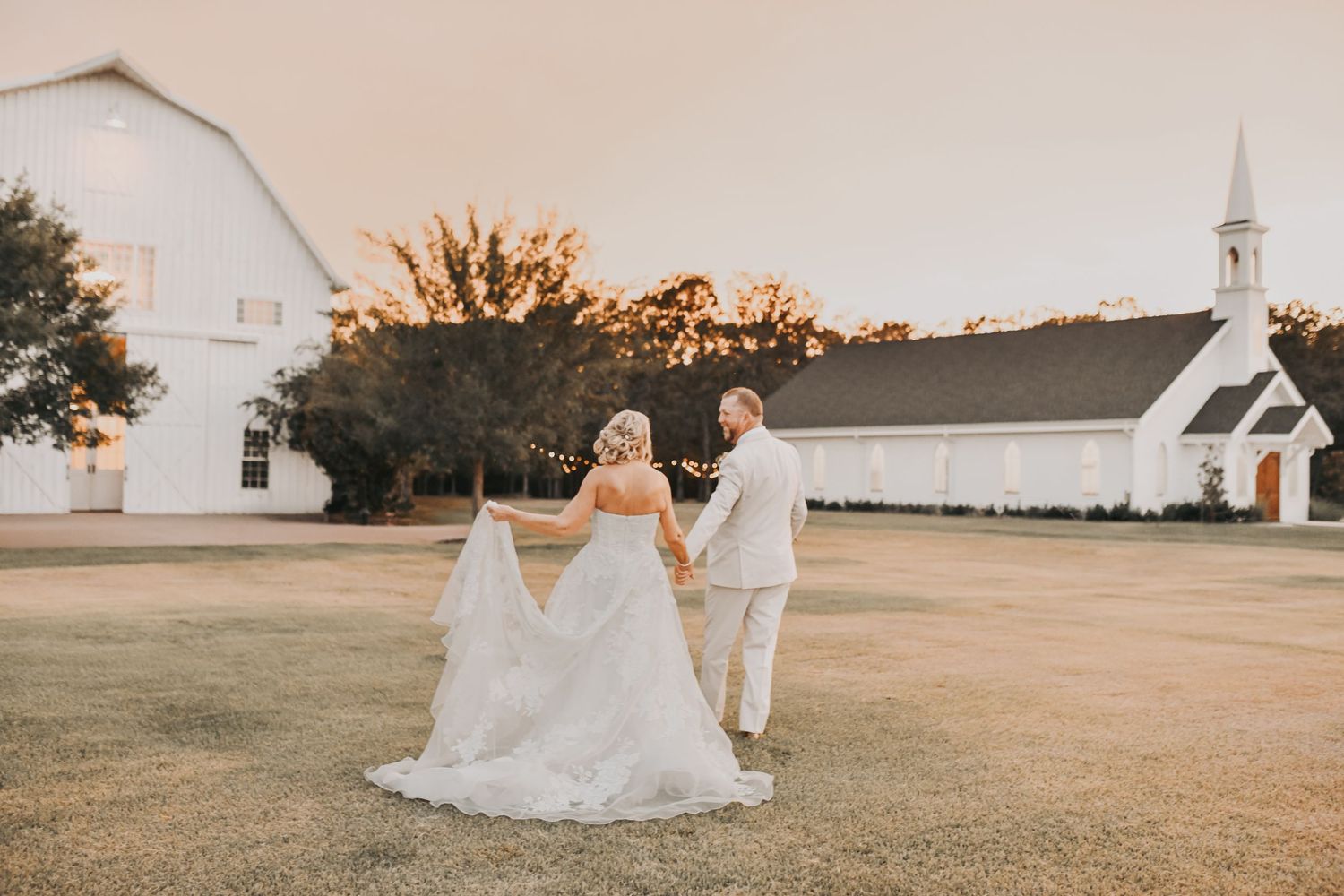 Bride and groom enjoying sunset portraits after their ceremony at The White Sparrow