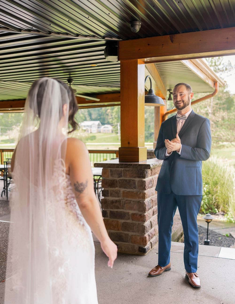 First look between the bride and groom on the grounds of Licking Springs Country Club, Ohio