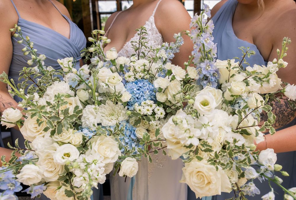 Light blue wedding bouquet with soft blue florals at a September wedding in Newark, Ohio