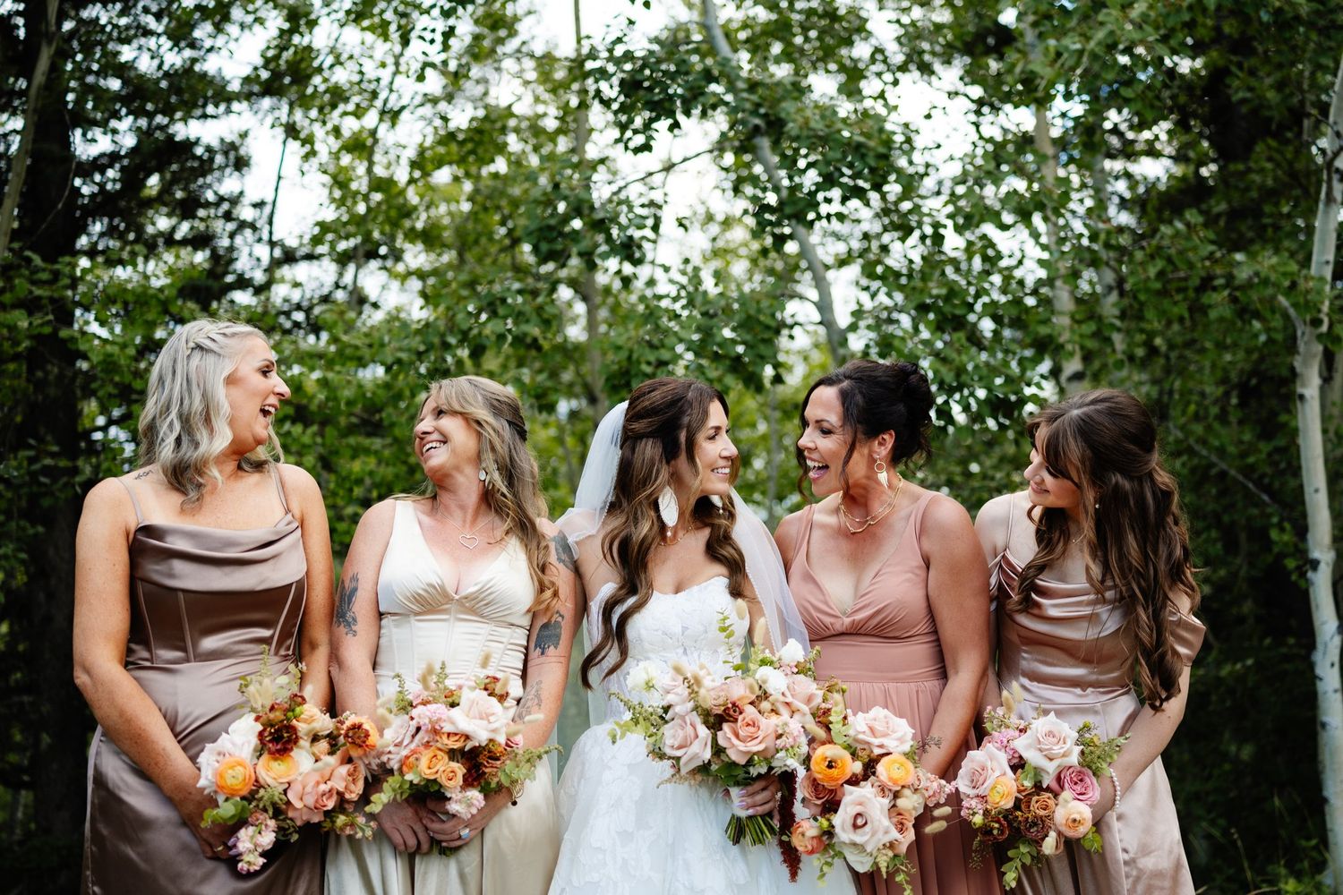 Bride and bridesmaids in the forest at Azuridge