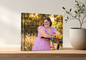 Custom canvas print displaying a senior girl in pink dress with flowers, personalized with Class of 2024 and name Kylie.