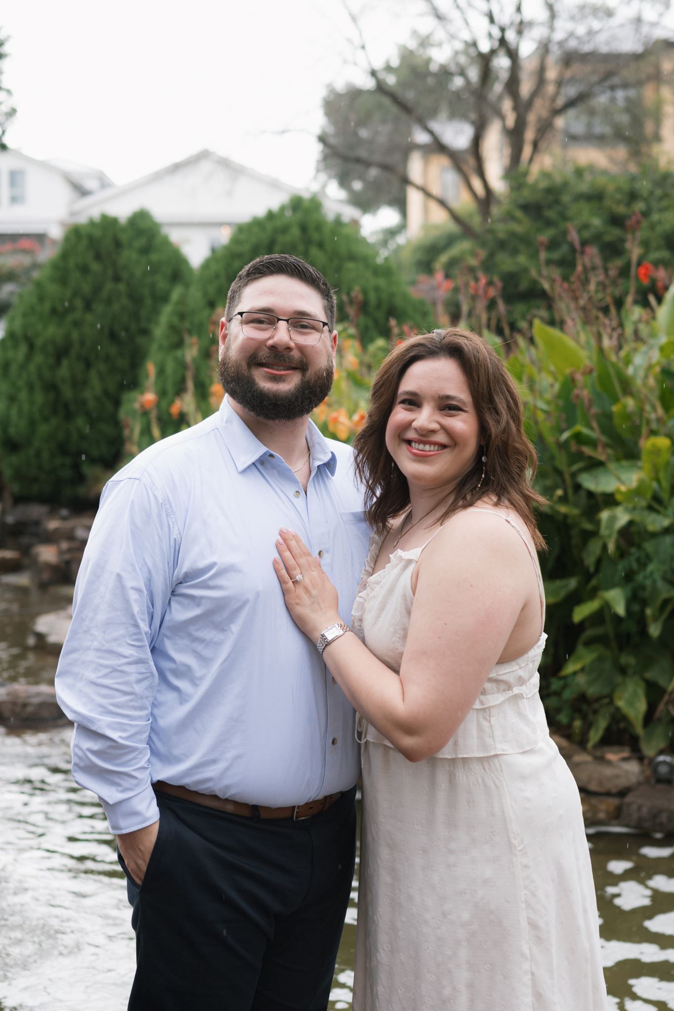 Newly engaged couple showing off the engagement ring after their proposal