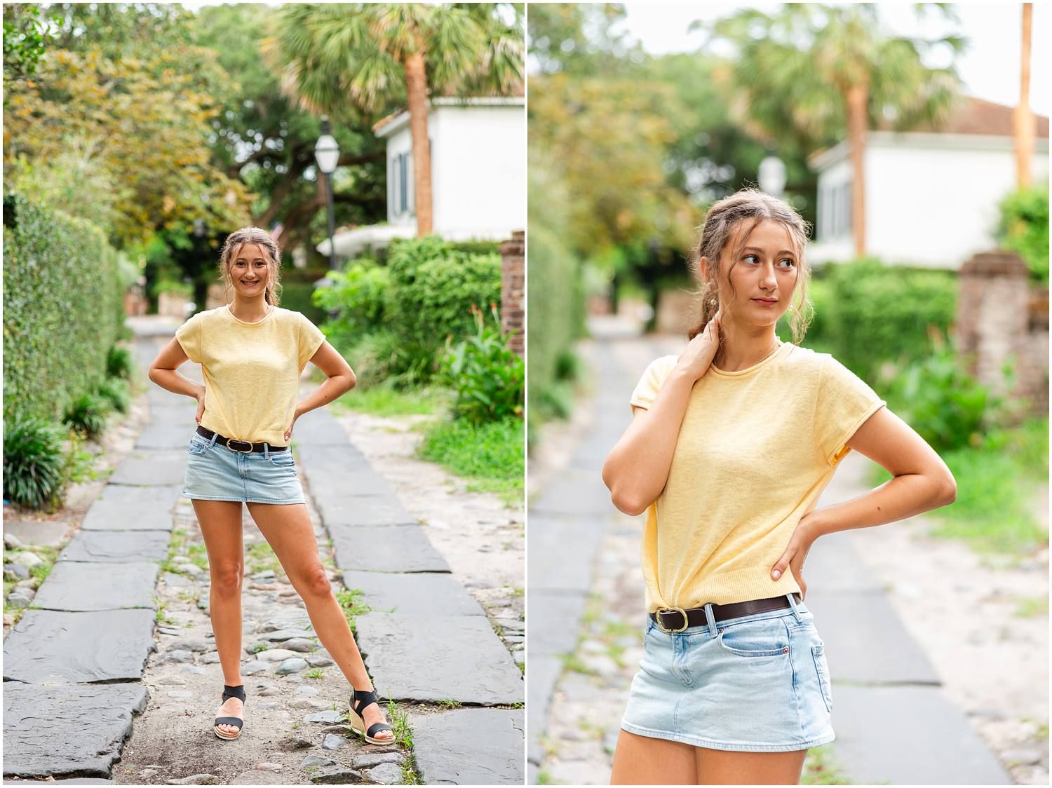 Young woman in yellow tee and denim skirt poses on a cobblestone path surrounded by lush greenery.