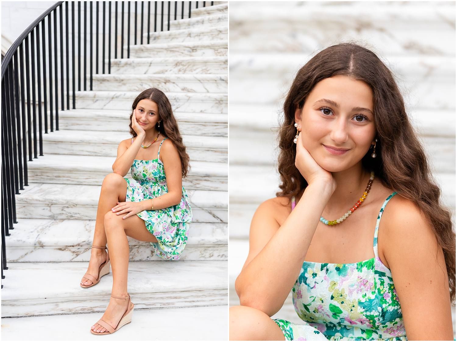 Teen girl in floral dress poses on marble steps for senior portraits.