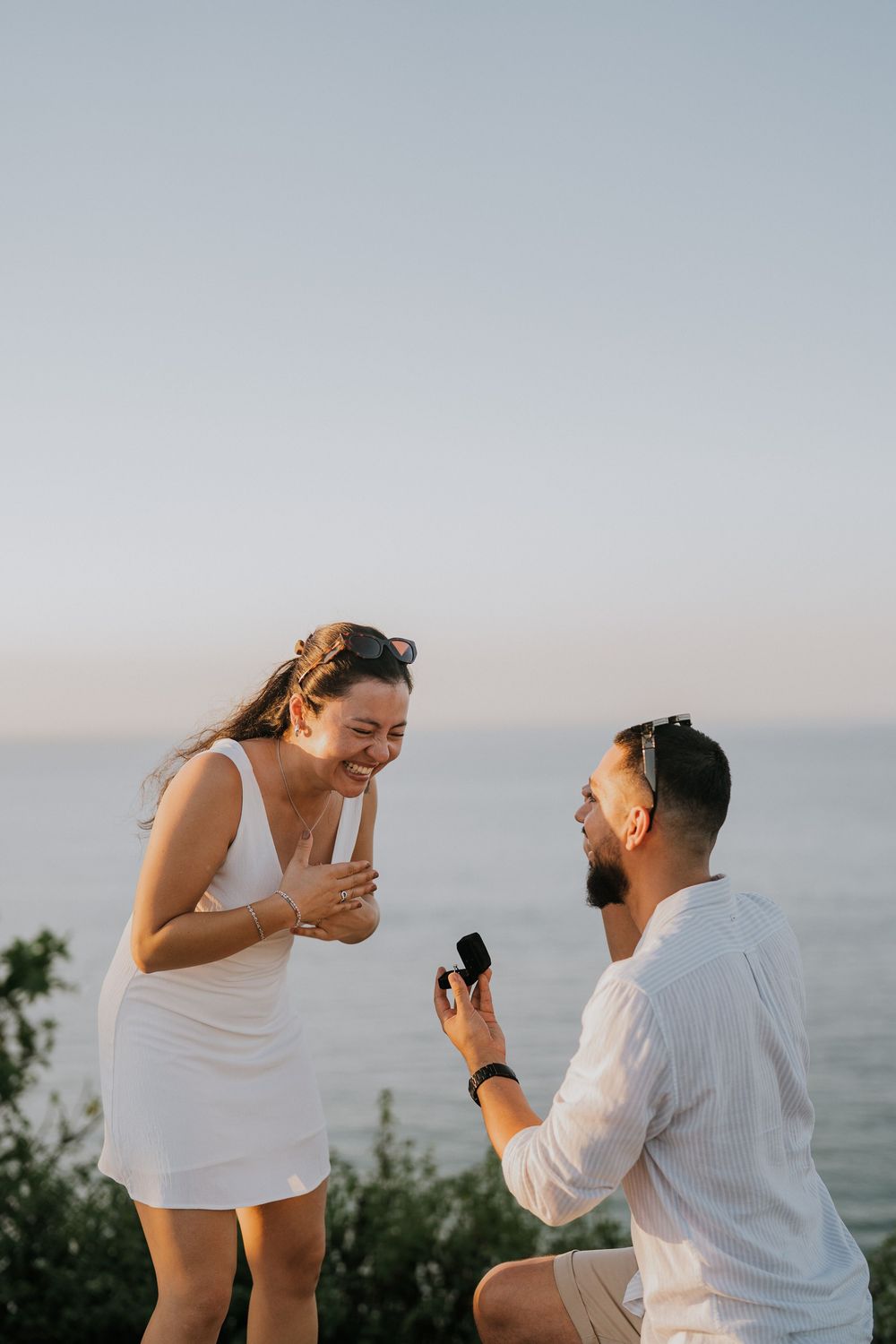 Secret proposal photography at Balangan Beach during sunset in Bali.