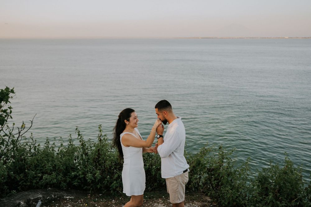 Secret proposal photography at Balangan Beach during sunset in Bali.
