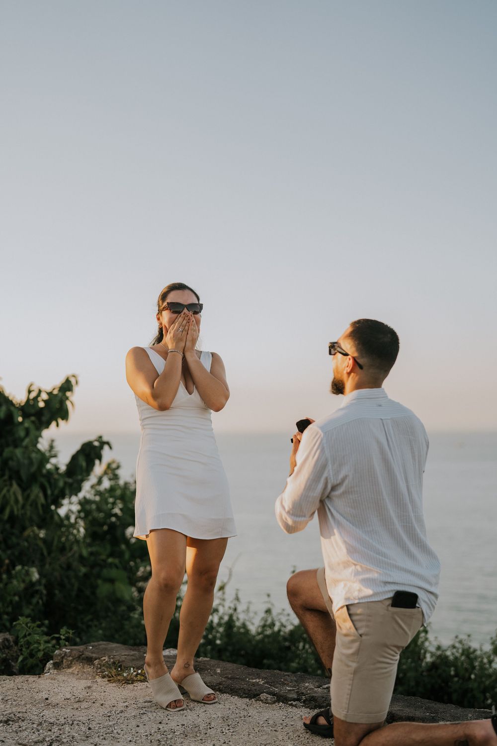Secret proposal photography at Balangan Beach during sunset in Bali.