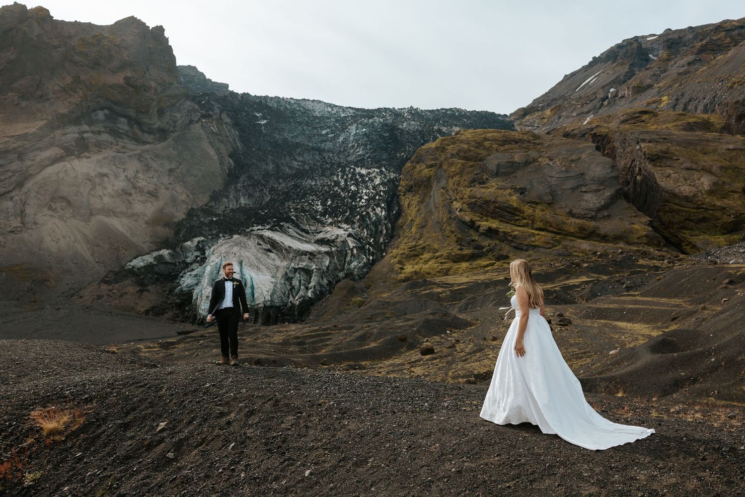 eloping couple doing a first look at Thórsmörk, Iceland with mountains and a glacier in the background