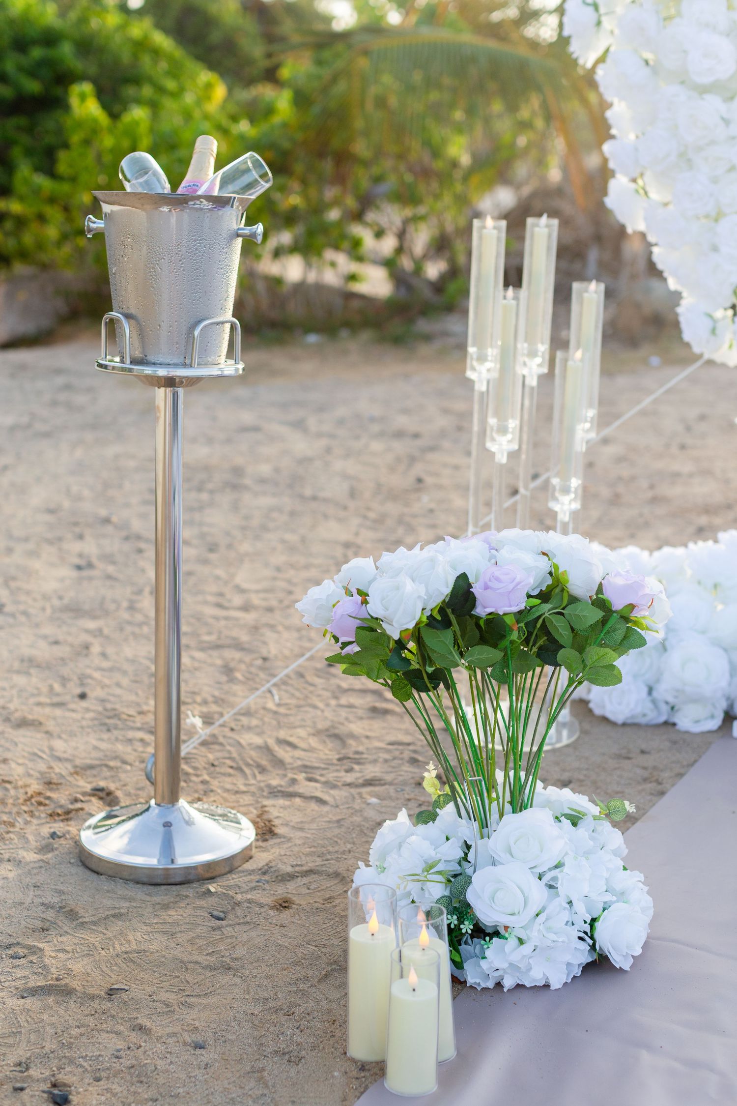 Details of a decorative setup for a marriage proposal. Champagne bucket, flowers, candles. Río Grande, Puerto Rico.