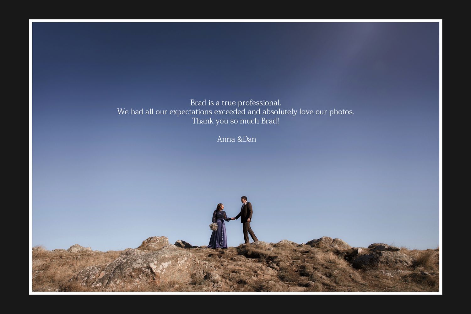 Couple posing on rocky hilltop at dusk, woman in purple dress, man in suit, with a testimonial quote overlay.