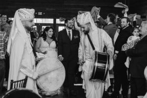 Vintage black and white photo of musicians in rabbit costumes performing at a wedding reception.