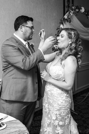 A series of four wedding photos showing a couple taking shots together during their reception celebration.