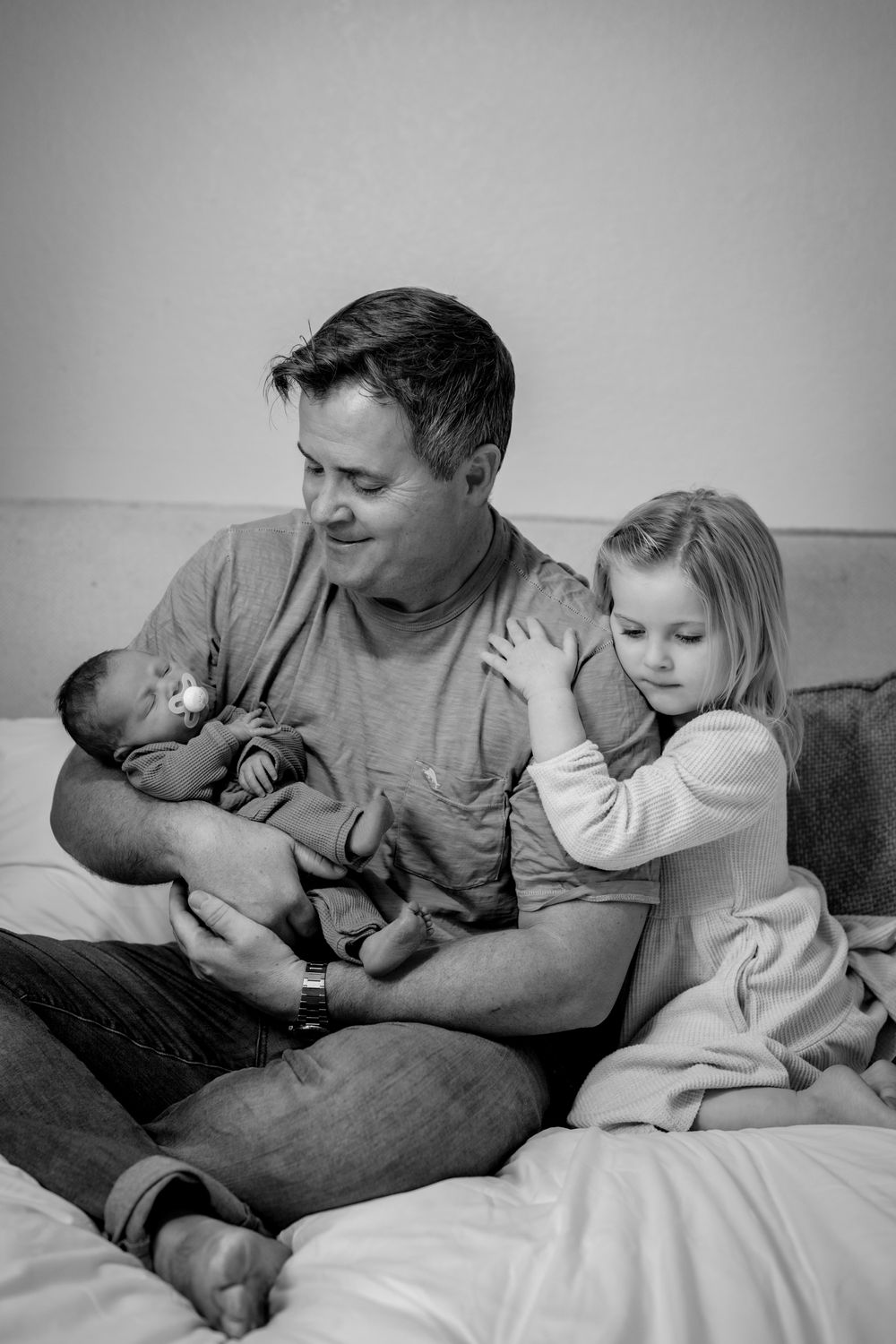 Black and white photos capturing intimate family moment. Lifestyle newborn photoshoot in Las Vegas. Newborn photographer Las Vegas.