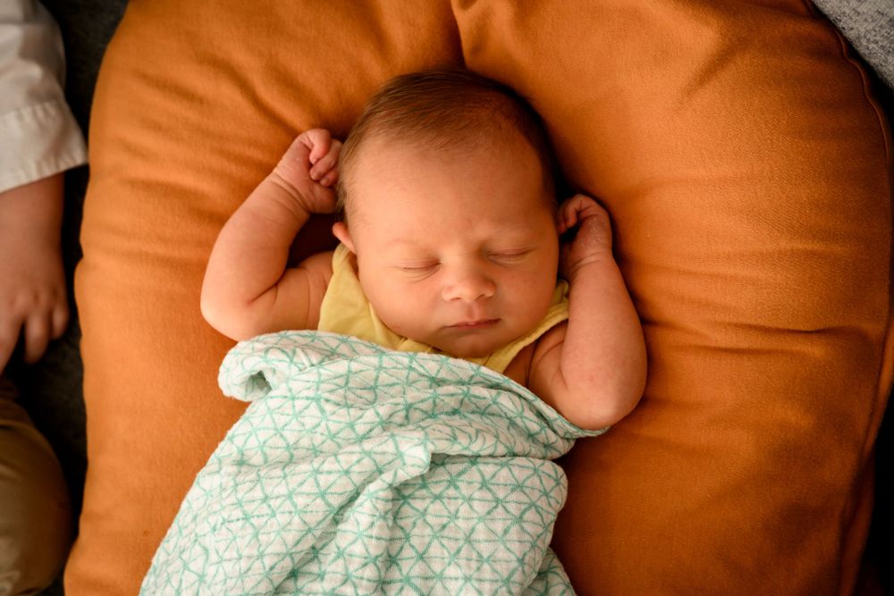 Sleeping newborn. Lifestyle Newborn photography in Las Vegas, Newborn photographer in Las Vegas. Family portrait photographer in Las Vegas.