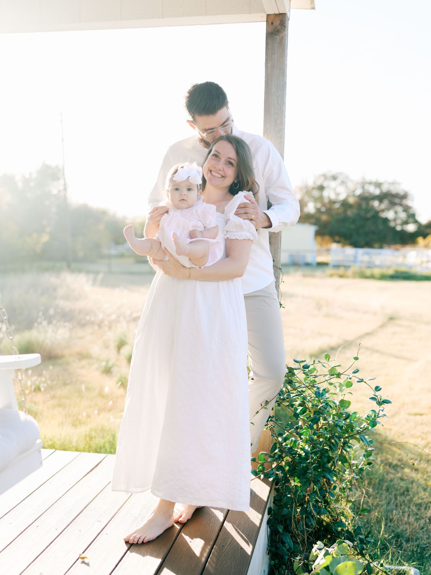 in-home newborn session of a couple, their baby boy, and their dog in the nursery