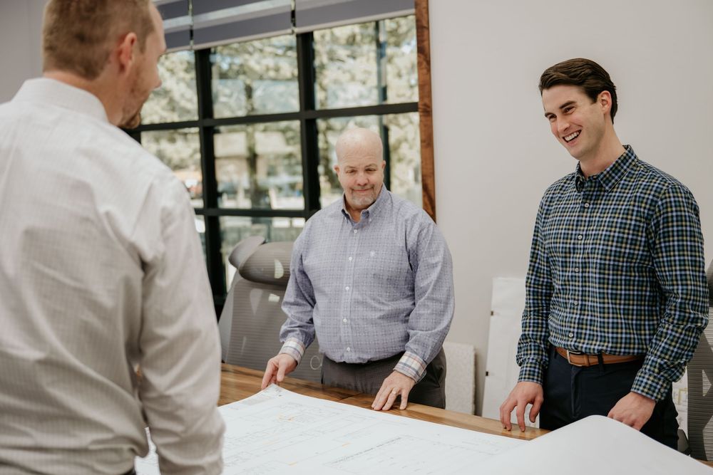 Business professionals collaborate around a conference table during a meeting.