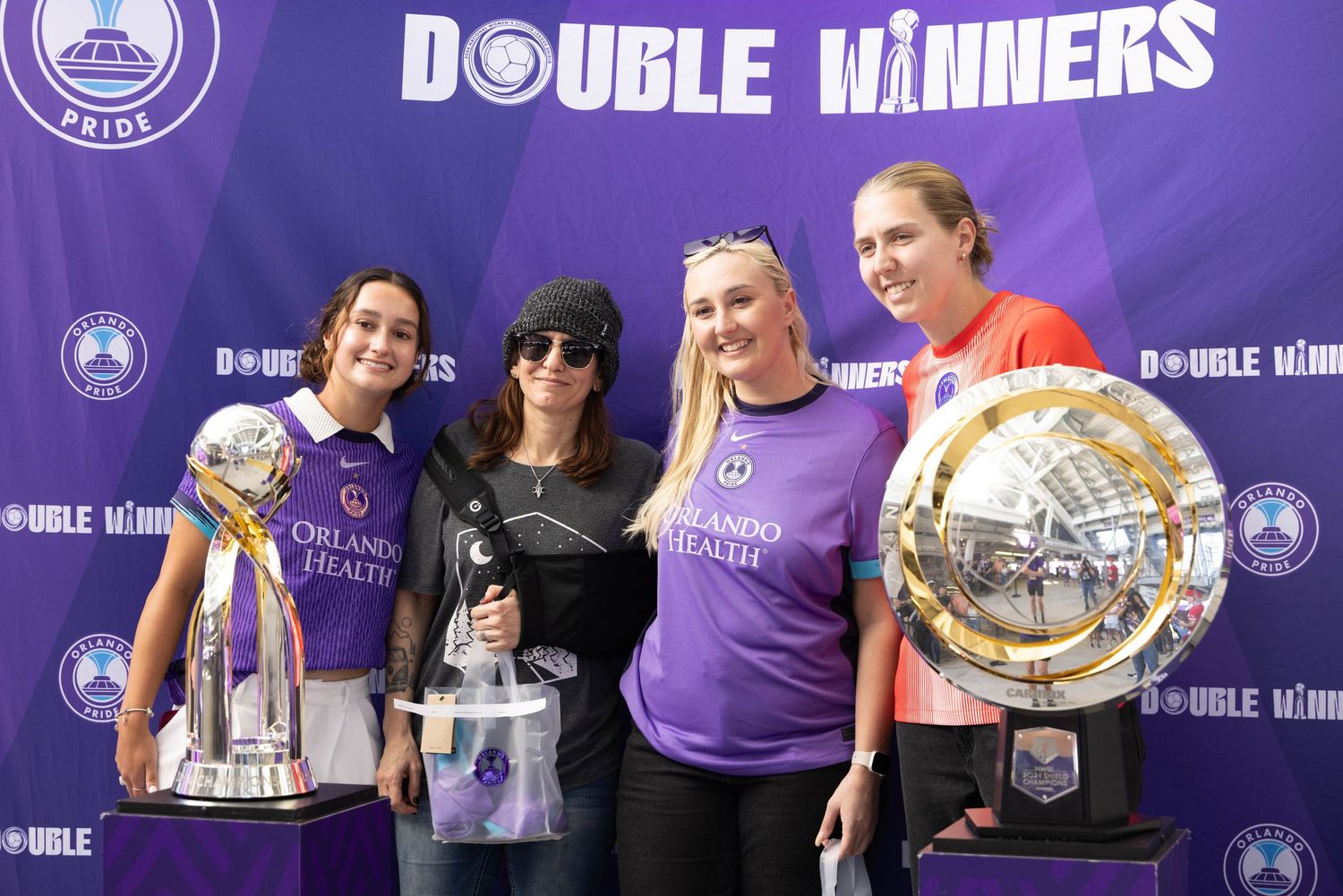 Purple banner display with 'Double Winners' text and team branding.