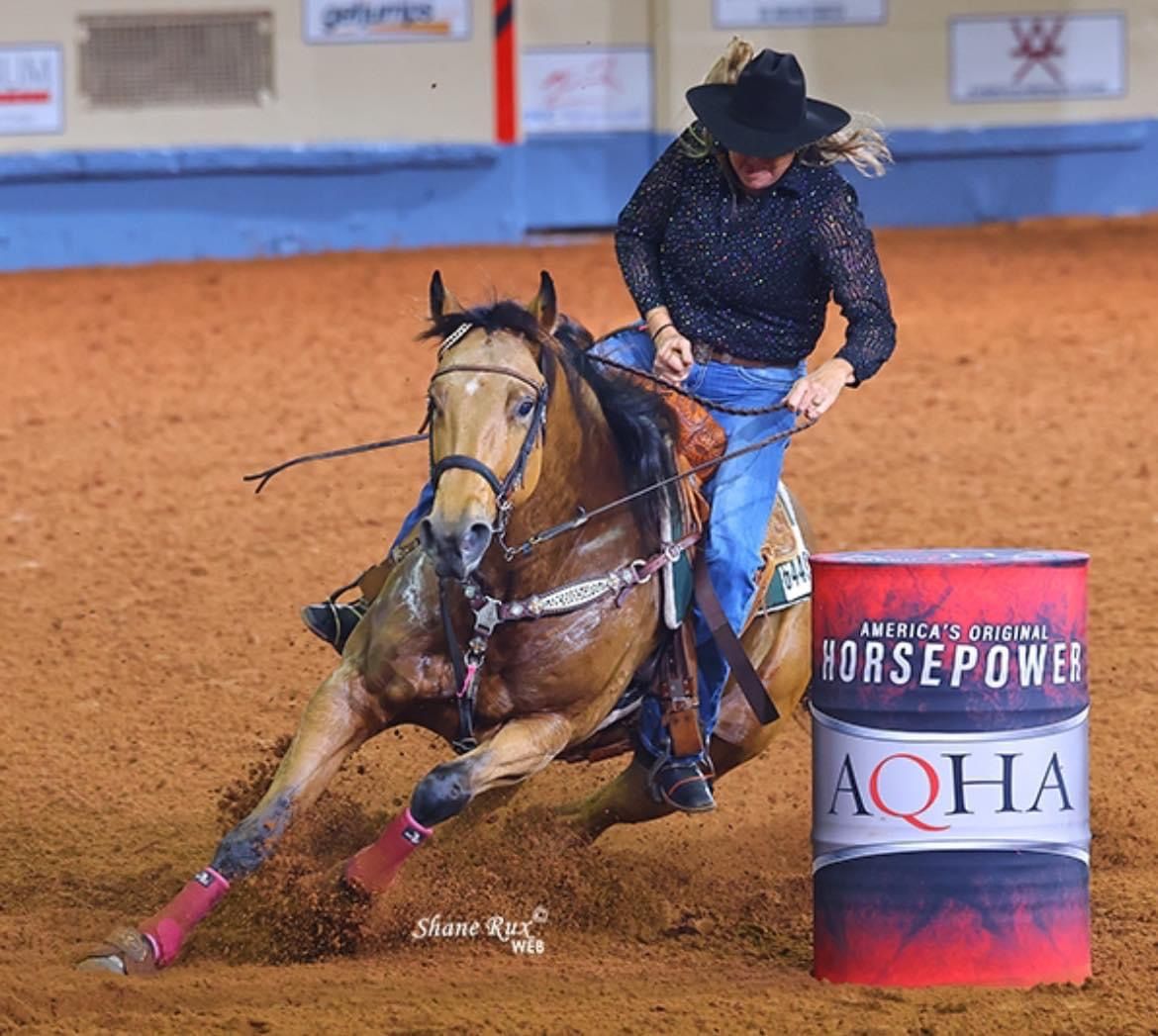 A barrel horse turning the first barrel