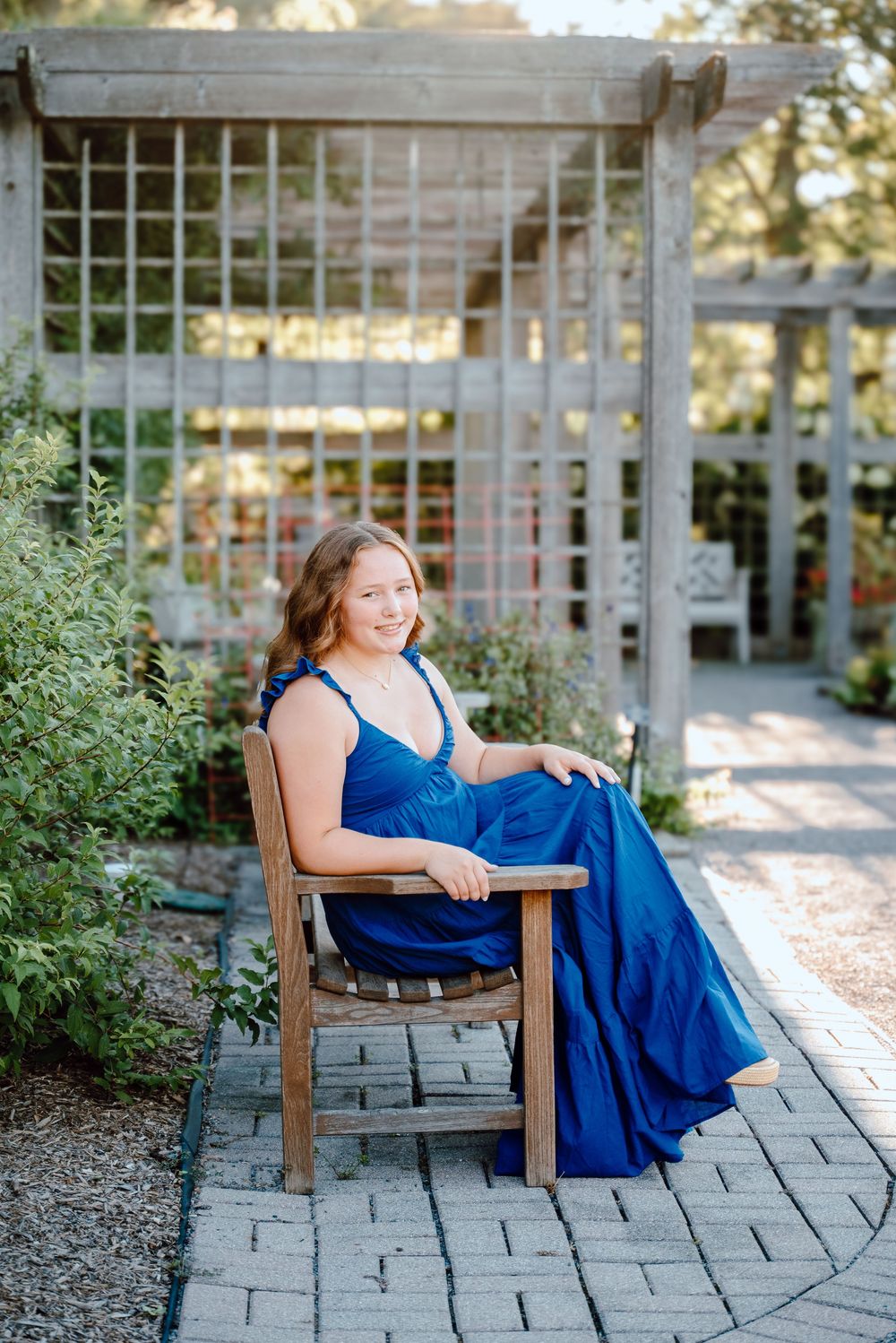 A series of photos showing a person in a blue dress relaxing on a wooden bench in a garden setting during sunset.