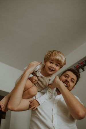A joyful moment captured in a sequence of candid interactions between two people sharing laughter and embraces.