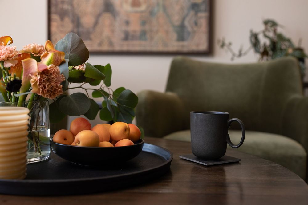 stock photo of mental health therapist room of tea cup with apricots and flowers in foreground and chair in background Tacoma, WA