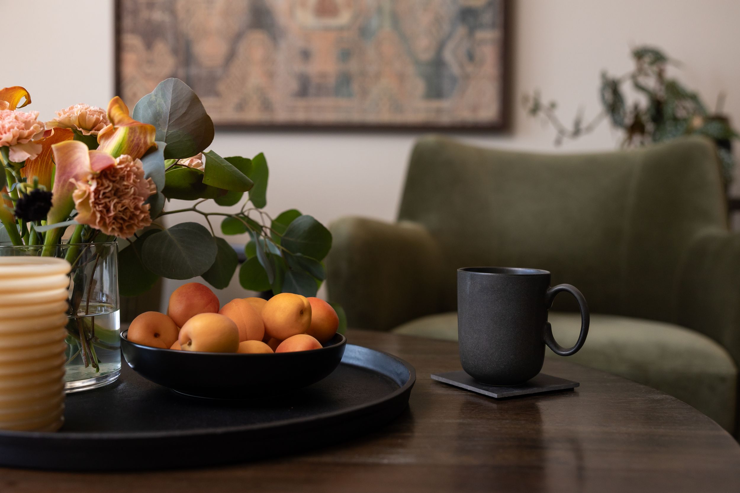 stock photo of mental health therapist room of tea cup with apricots and flowers in foreground and chair in background Tacoma, WA
