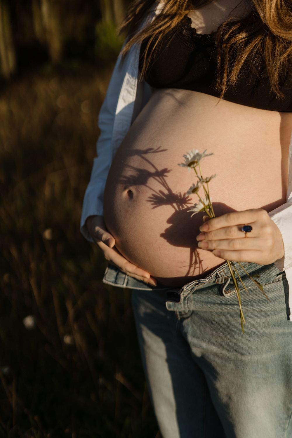 Sunset Maternity Sessiom with baby bump and wild daisies